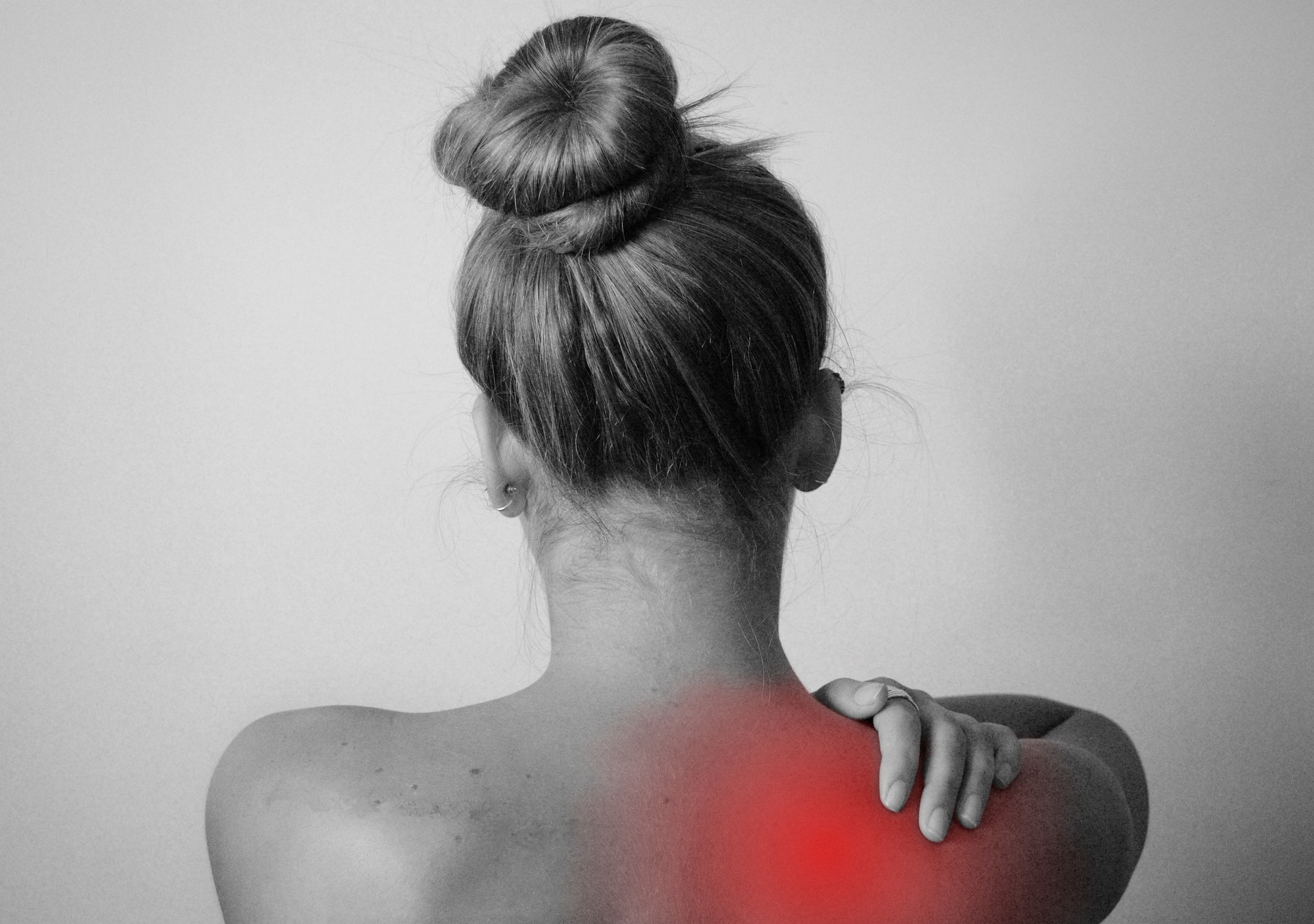 woman showing back pain - inflammation